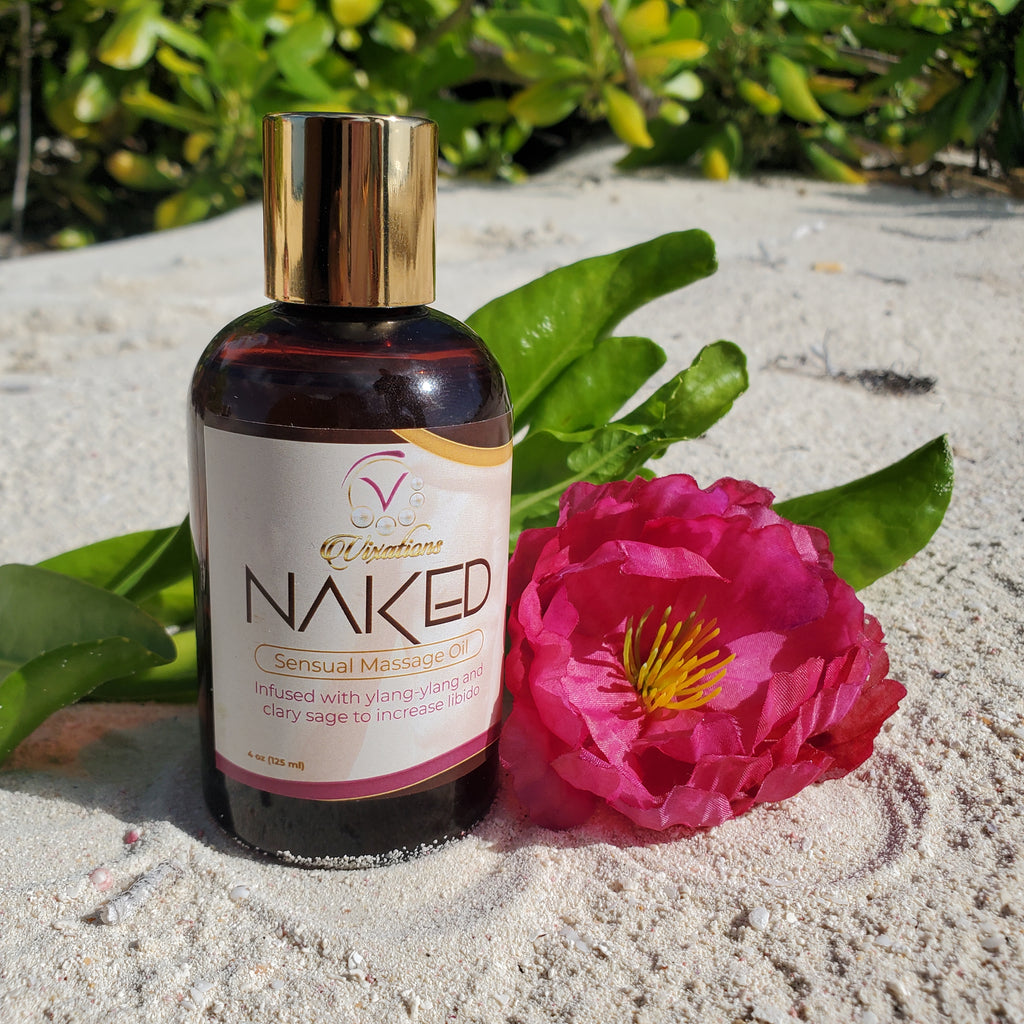 Sensual massage oil shown on beach in Nassau, Bahamas. Sold at Vixen's Lair adult novelty and lingerie store.